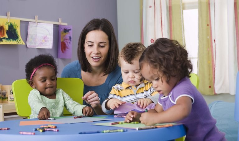 Teacher and toddlers in daycare