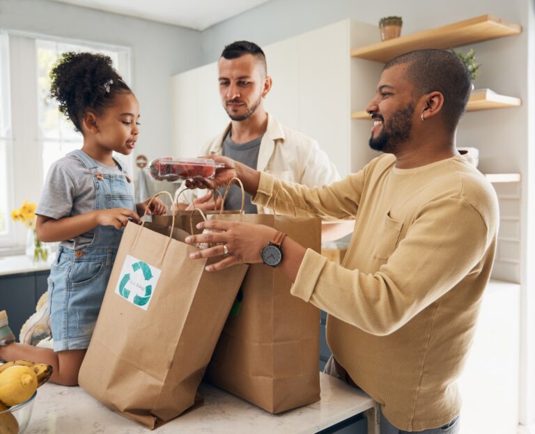 Happy family, shopping and bags of groceries in home and curious, excited girl with gay parents, da